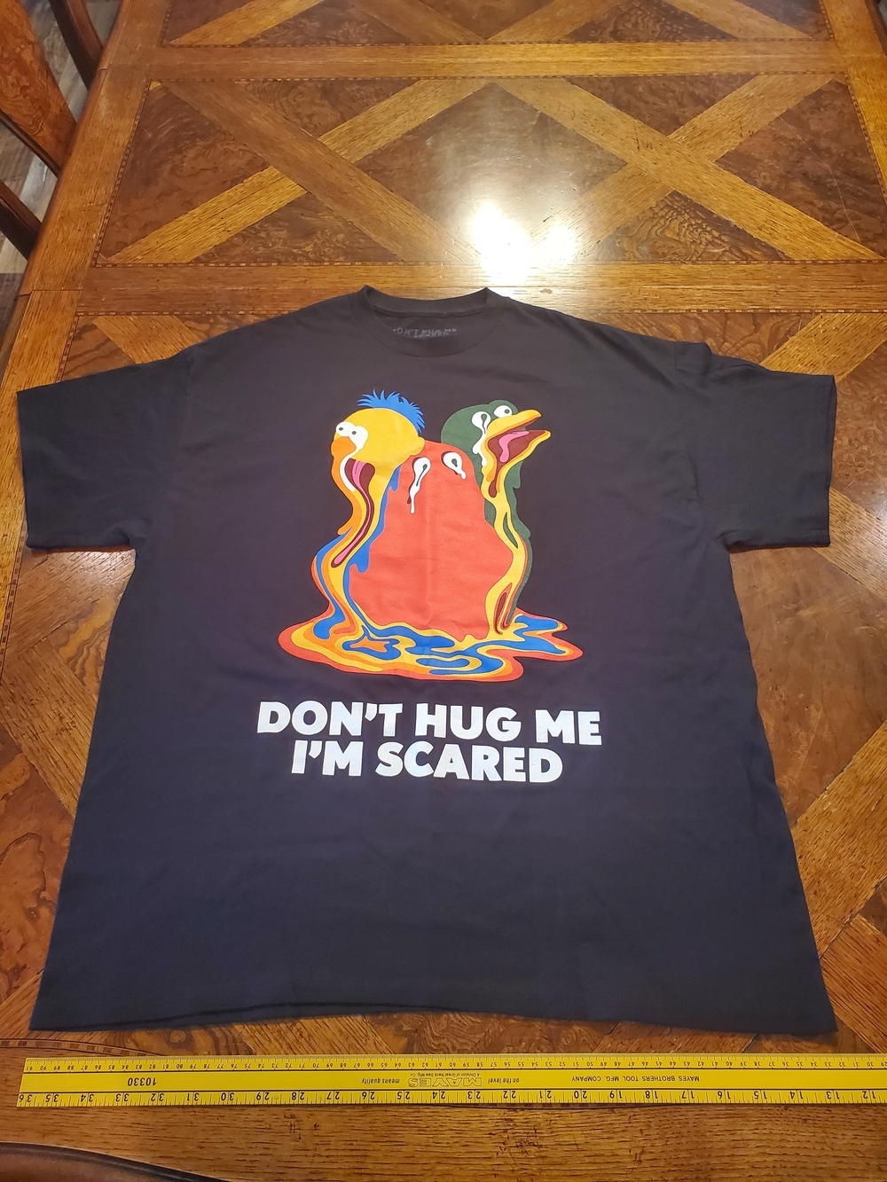 Spencer's Black Don't Hug Me I'm Scared Unisex Graphic Tee Melting Characters